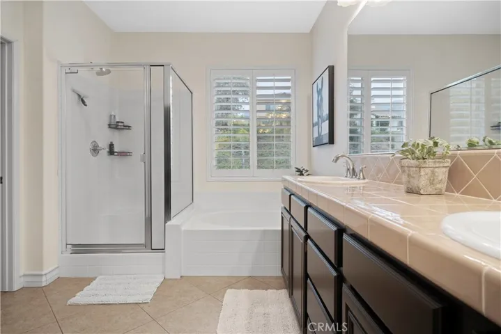Primary bathroom walk in closet w/ soaking tub
