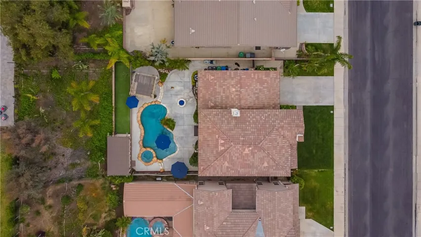 Top view of house and pool with slope