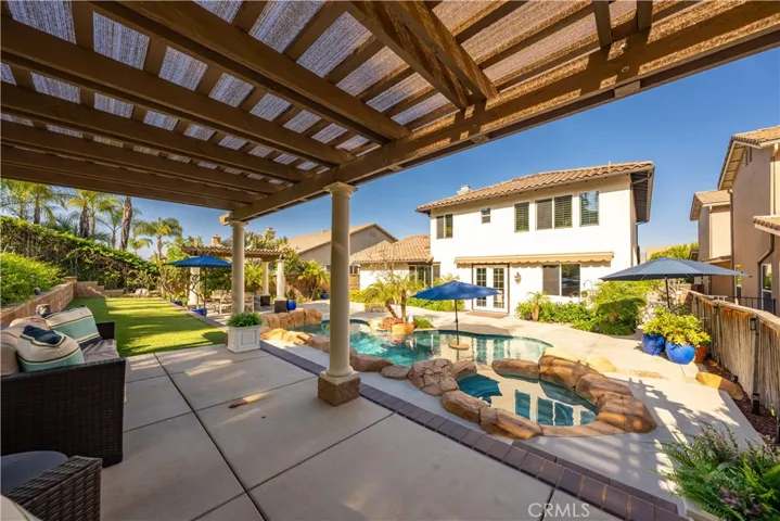 Upper permanent patio to pool and back of house