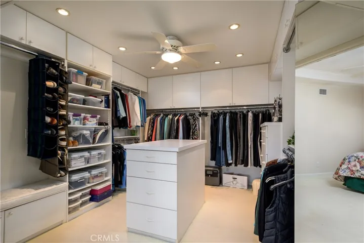 Custom-designed walk-in closet which used to be the 5th bedroom