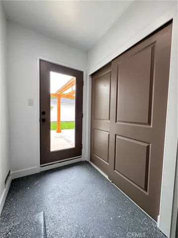 Laundry area, off Family Room direct access, behind sliding doors.