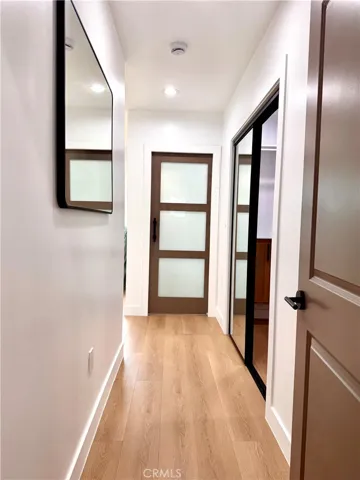 Primary Bedroom entrance with Walk-in closet to the right, primary bath directly in front and Primary bedroom on the left