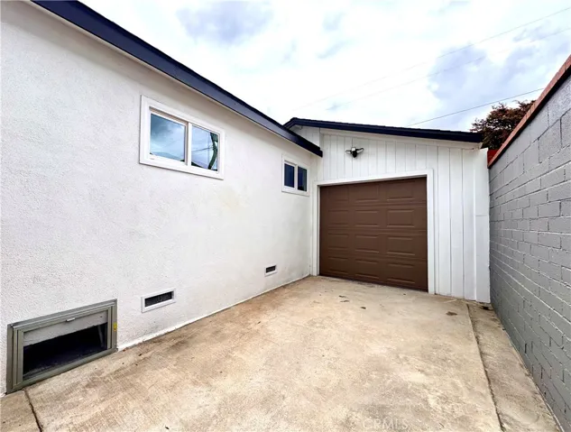 Attached Large Double car garage behind garage door