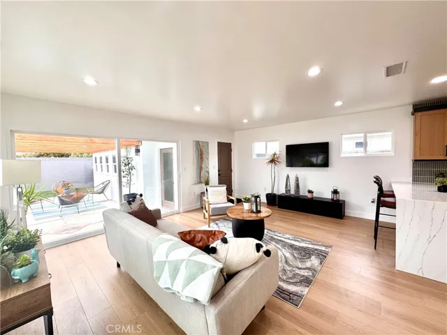 Family room with HUGE back patio & pergola