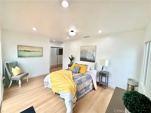 Primary bedroom facing Southeast, with Walk-in closet behind Mirror closet doors.
