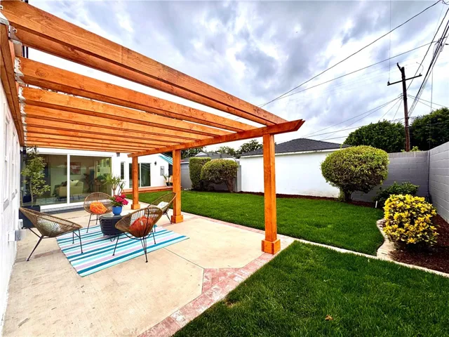 Huge Grassy Backyard with Patio & Pergola off the Family Room & Deck off the Primary Bedroom.