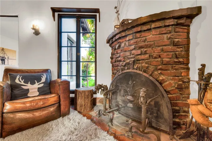 Brick fireplace and custom accessories in the den.