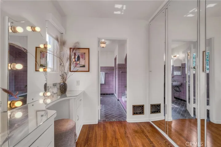 Vanity area and bathroom adjacent to primary suite.