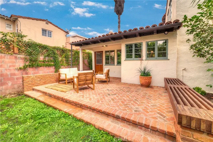 Bricked patio behind the game room.