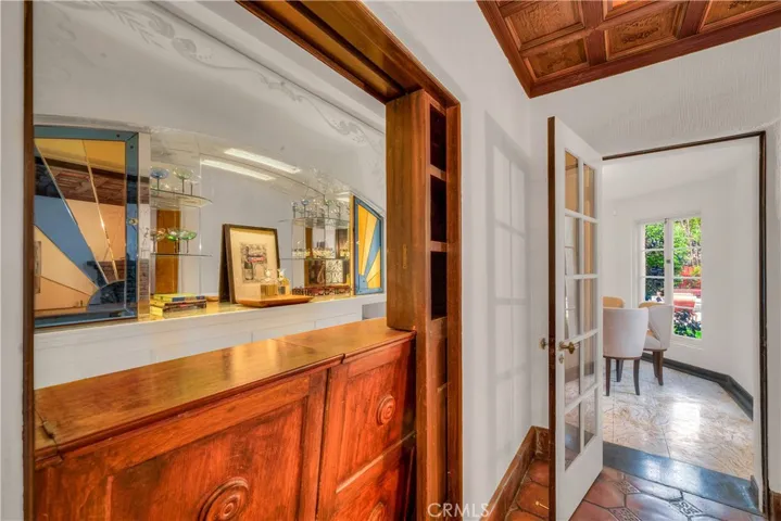 Close up of the hidden art-deco bar; looking into the breakfast room.