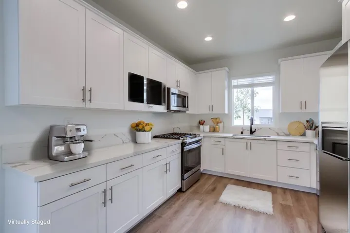 All new appliances.  You will be the first to use them and there is full warranties on all.  All pictures with furnishings are virtually staged simply to show what might be the new owners beautiful home.