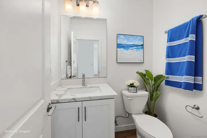 And here is the 1/2 bath that is downstairs for everyones convenience.  All pictures with furnishings are virtually staged simply to show what might be the new owners beautiful home.