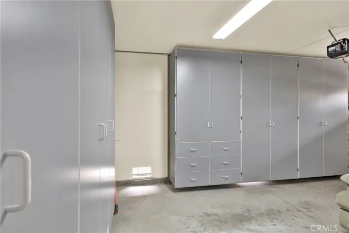 The lovely finished garage cabinets with roll outs also.