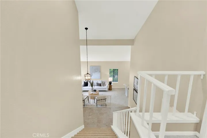 Wide staircase, open hallway.