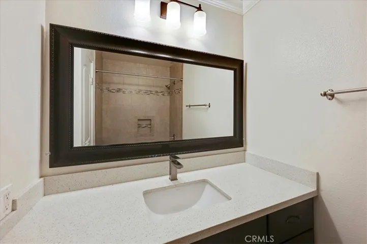 Guest bathroom with beautiful granite tiled tub/shower.