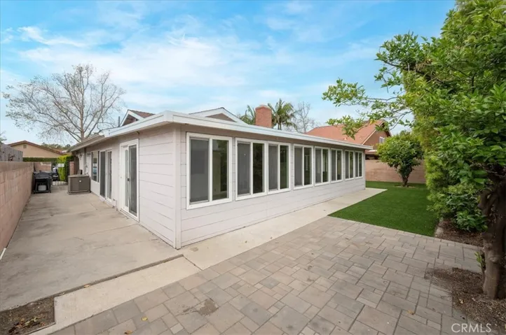 Concrete slab for barbeque, tools etc. Easy access through side gate to front yard. Pavers for additional outdoor sitting space.