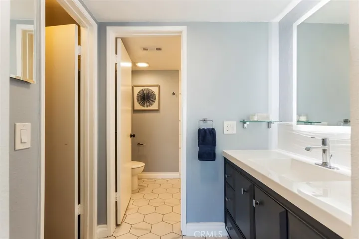 primary ensuite bath with walk in closet