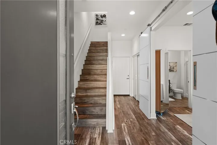 Welcome to 1651 Topanga, direct entry garage door at the end of the hallway