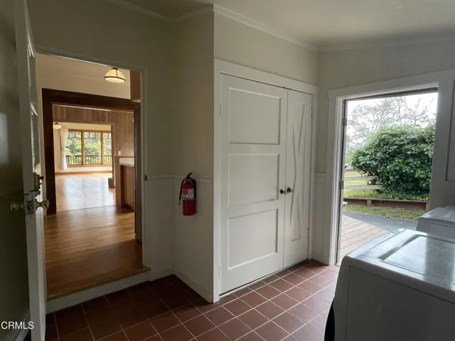 Tiled Laundry Room Adjacent to Kitchen