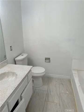 Hall bathroom - new tile, re-glazed tub and countertop, new faucet
