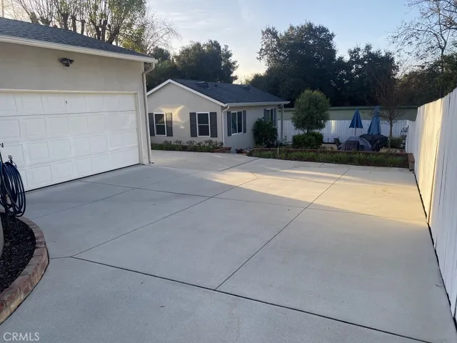 Extra large driveway leading to RV parking+side fence can be moved back approx. 1.5' for easier access