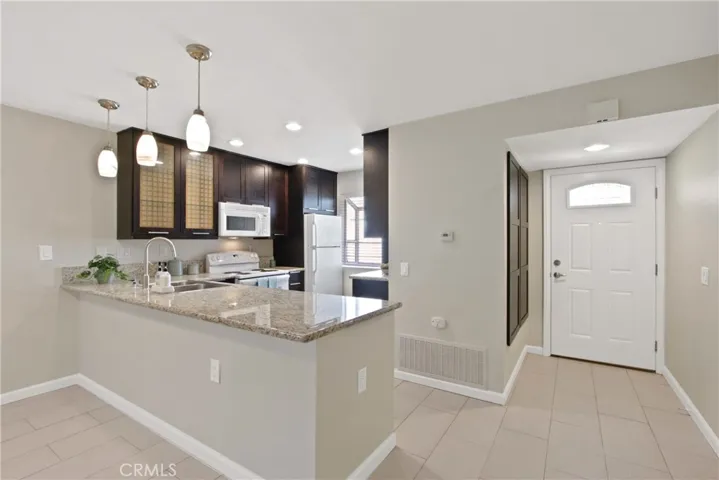Upgraded kitchen with refrigerator, stove, garbage disposal and microwave included! Storage closet located on the left of doorway.