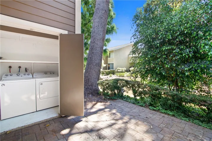 Storage closet is located conveniently outside your back door and contains a washer and dryer to save you time and money!