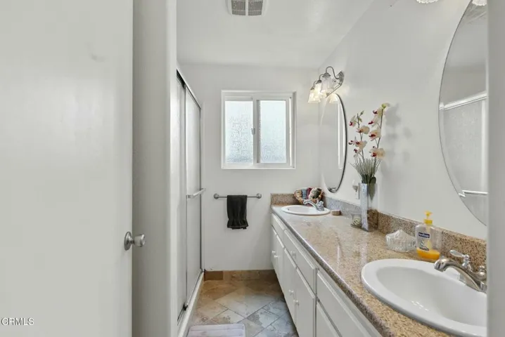 Double Vanity Hallway Bathroom