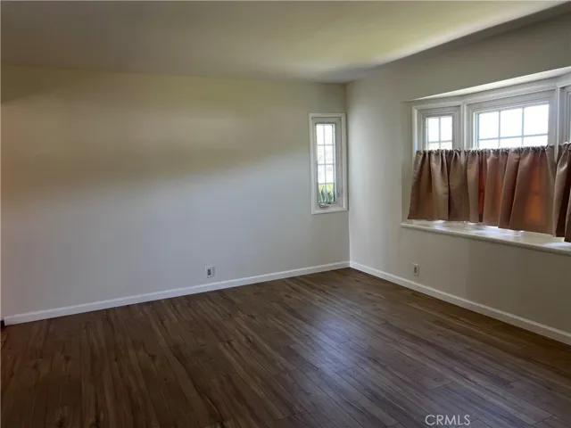 Other angle of living room and dining area
