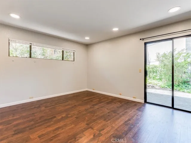 Primary has sliding doors to the back deck.