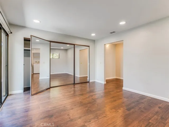Another view of those closet doors--and you can see that the laundry is downstairs where the clothes live.