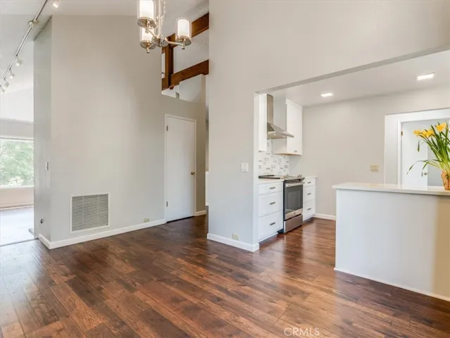 Looking from the dining area to the kitchen and living room.