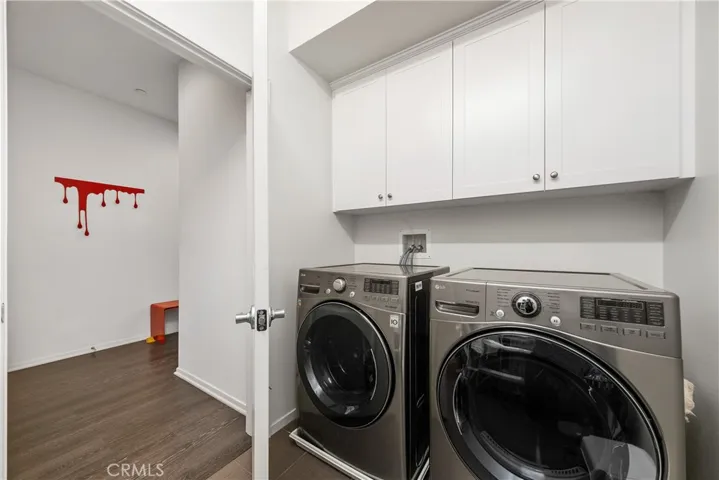 laundry room with extra storage