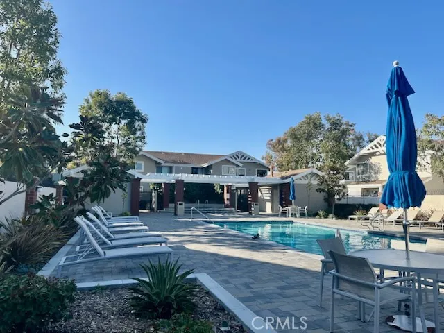 Community pool with lounge chairs and sitting area