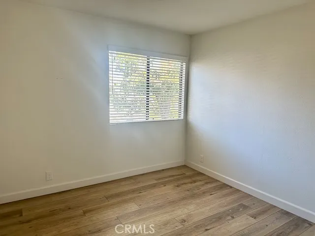 Second bedroom with view of pool