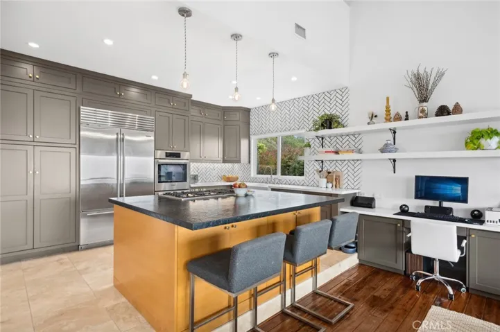 Inside, recent comprehensive renovations blend coastal sophistication with comfort, featuring open, light-filled living spaces, upgraded kitchen, built in cabinetry, a dedicated laundry room, custom lighting and ample storage throughout.