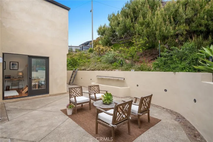 Outdoor areas are equally refined, offering a variety of functional and peaceful spaces.