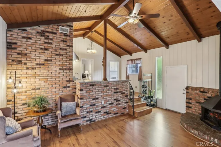 Sunken Family Room, Beamed Ceilings, Fireplace and Kitchenette Wet Bar