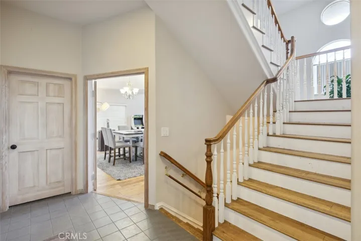 Stairs lead up to master suite, 2 additional bedrooms, and a full bathroom