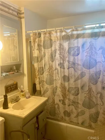 Shower with tub, vanity and toilet