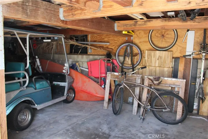garage with sump pump and storage- work shop too
