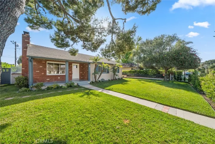 Welcome to 493 E 19th Street! This detached, single story home includes a beautiful, fully fenced front yard!