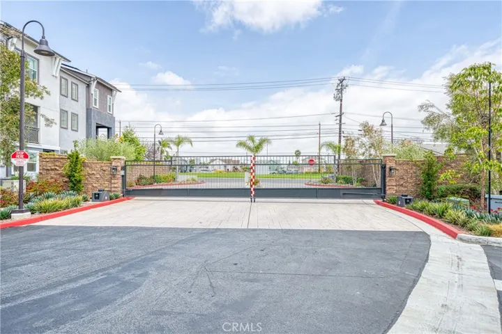 Community gated entrance with plenty fo guest parking spaces.