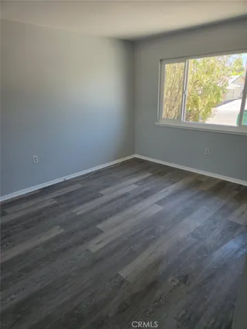 Primary bedroom with mirrored closet doors