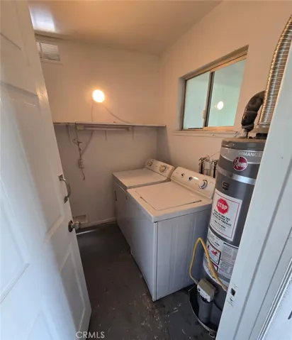 Laundry room with a washer and dryer included