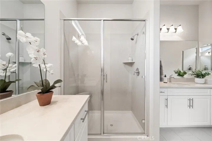 Walk-In Shower with Sleek Glass Doors and Contemporary Fixtures