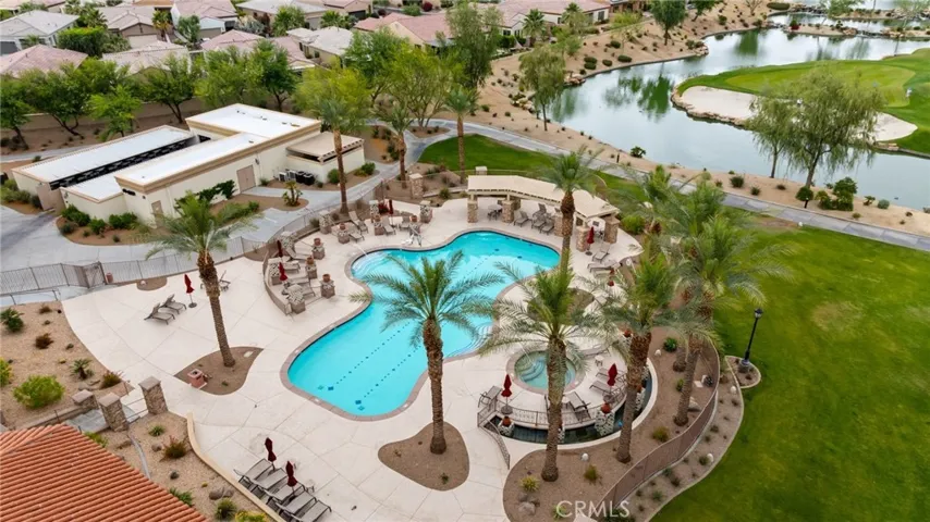 Relax in the Resort-Style Pool and Spa, Surrounded by Lush Landscaping and Scenic Golf Course Views
