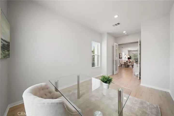 Open-Concept Office with French Doors and Seamless Flow to Main Living Space