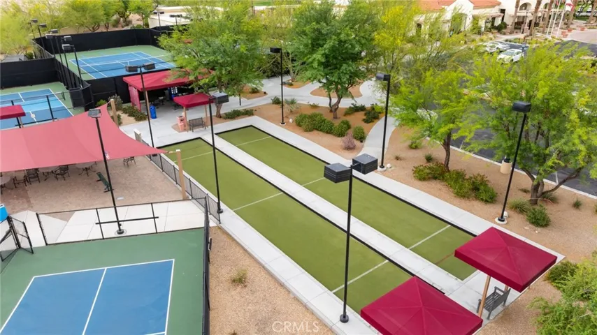 Enjoy Friendly Competition on the Well-Maintained Bocce Ball Courts, Nestled Among Lush Landscaping and Shaded Seating Areas