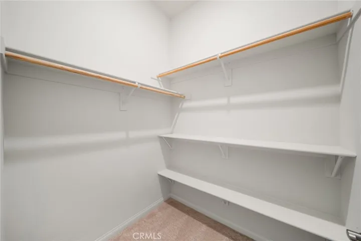 Walk-In Closet with Built-In Shelving and Ample Hanging Space